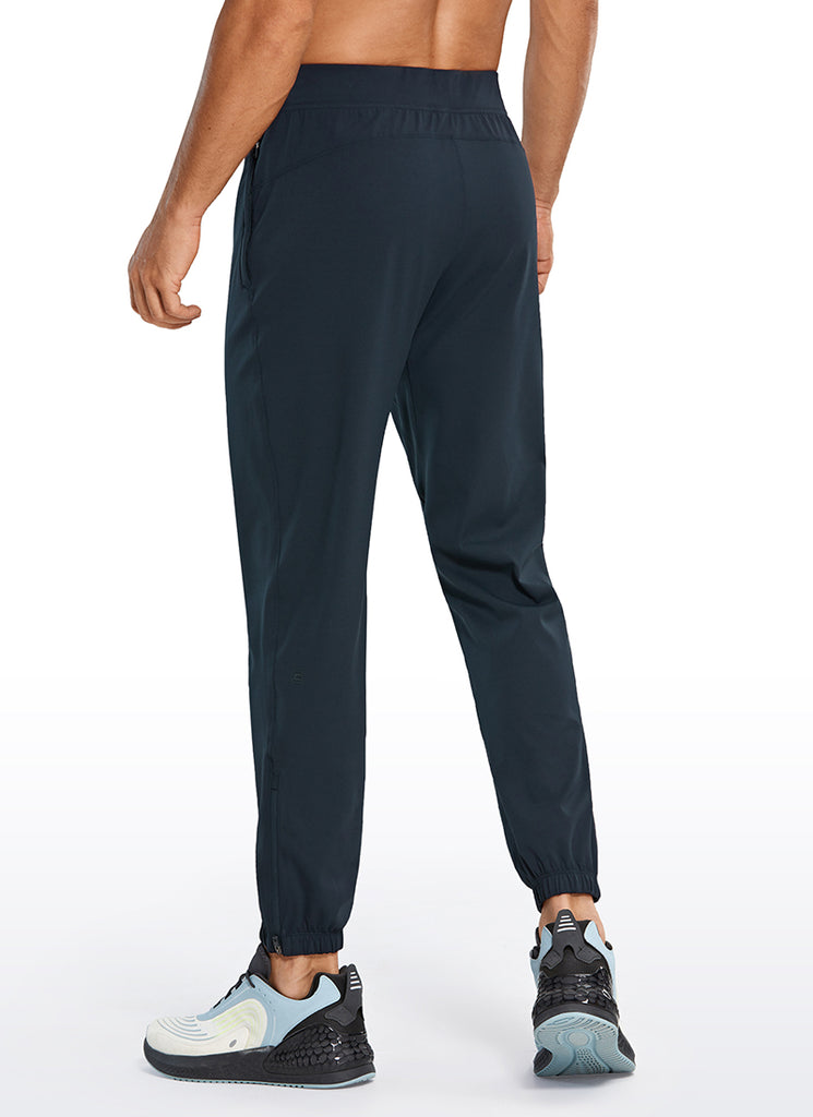 CRZ YOGA Men's Run Slim Fit On the Travel Joggers 28''- Ankle Zipper True Navy