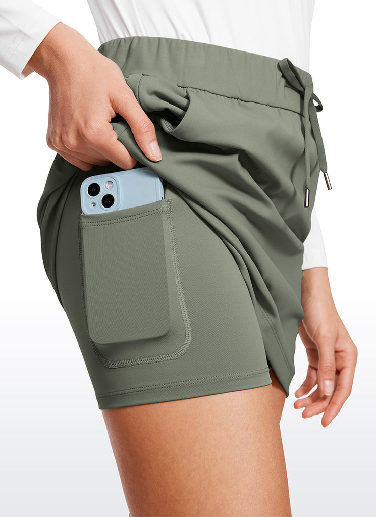 CRZ YOGA Women's Casual Golf Stretch High-Rise Drawstring Skirts 15" True Navy