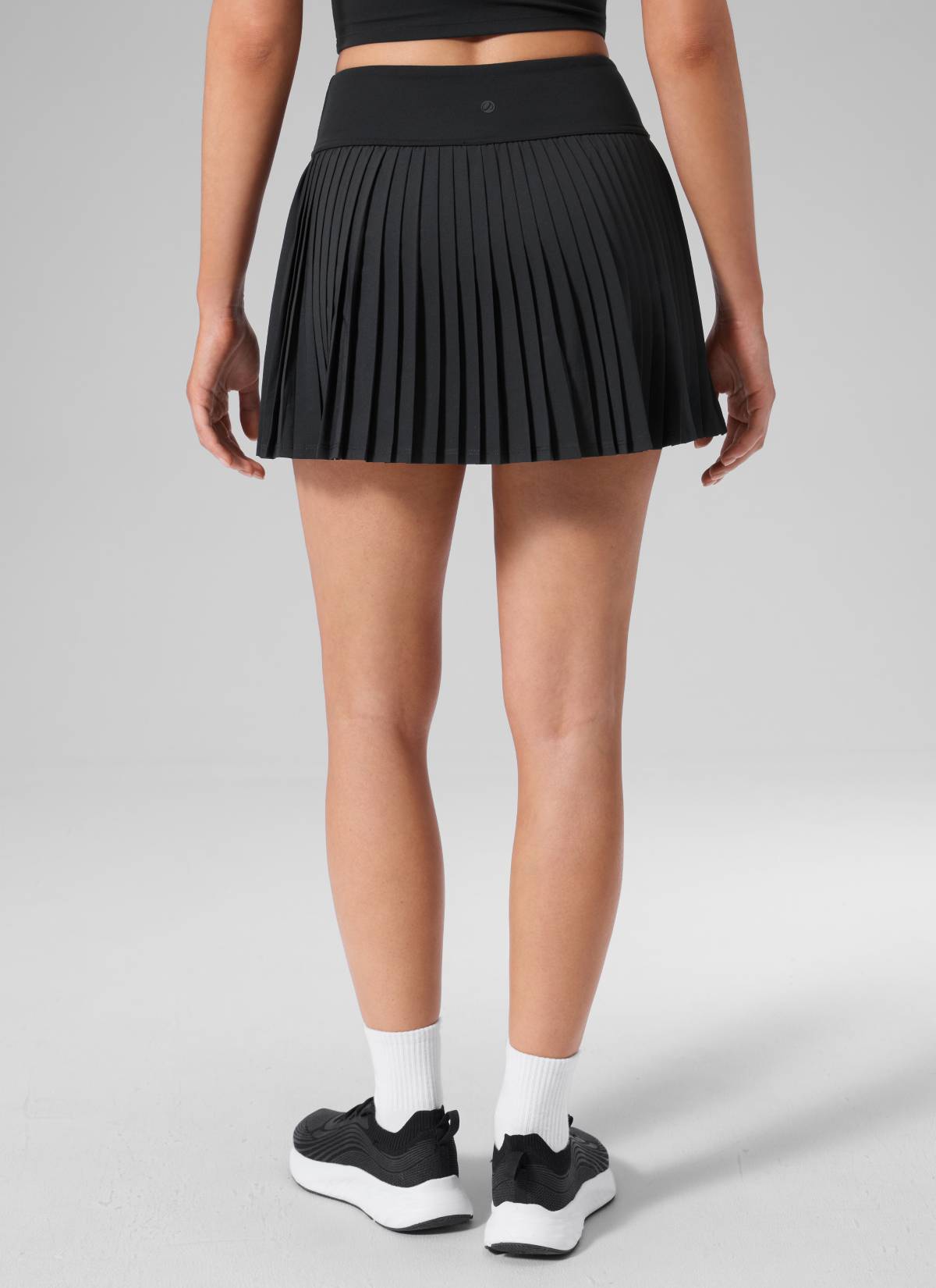 CRZ YOGA Women's Dual-fabric Tennis Pocket Pleated Back Mini Skirt Black