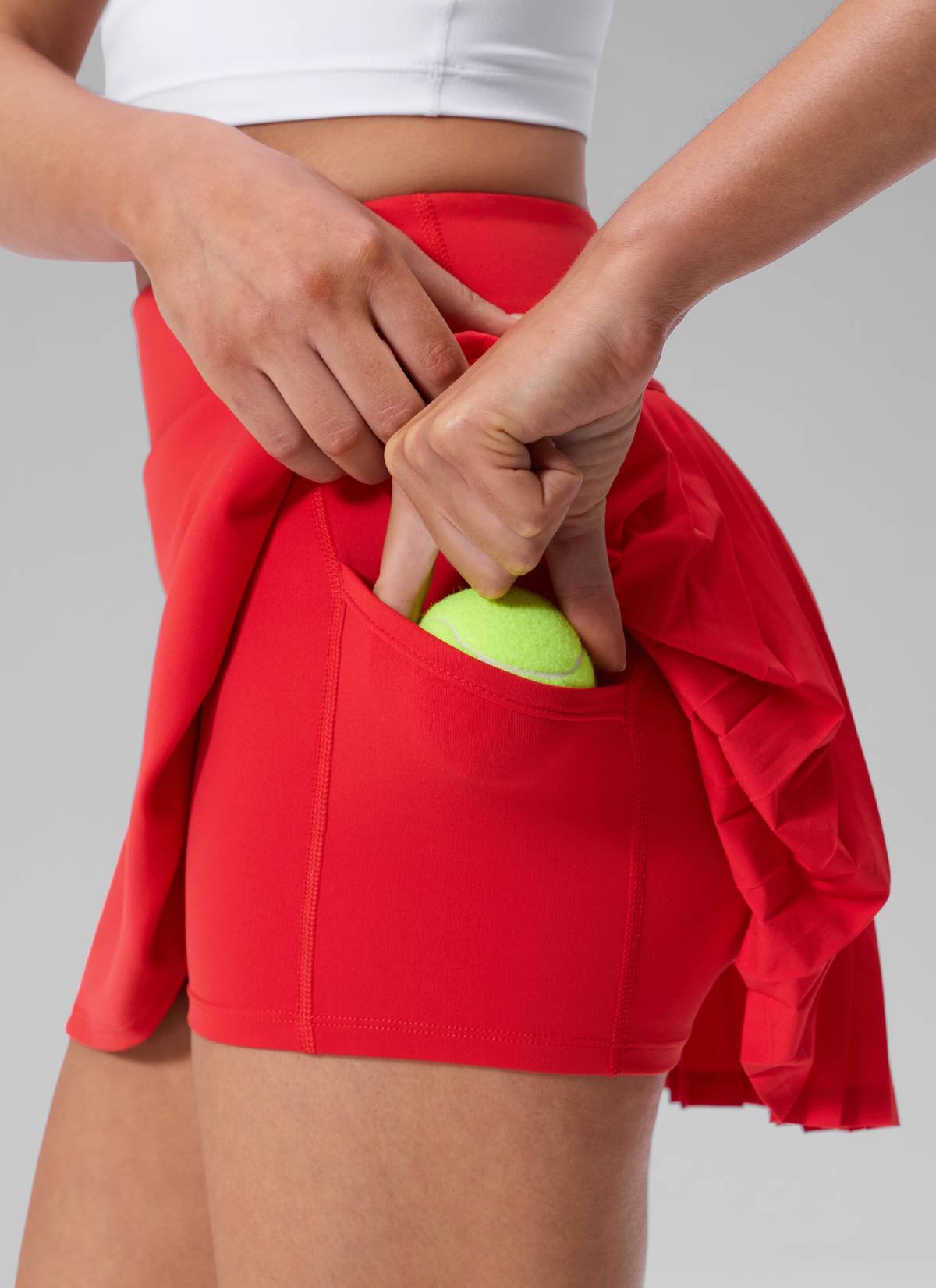 CRZ YOGA Women's Dual-fabric Tennis Pocket Pleated Back Mini Skirt Deep Red